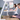 Man working at desk and a woman working at a standing desk