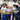 Factory workers shaking the hand of a business woman